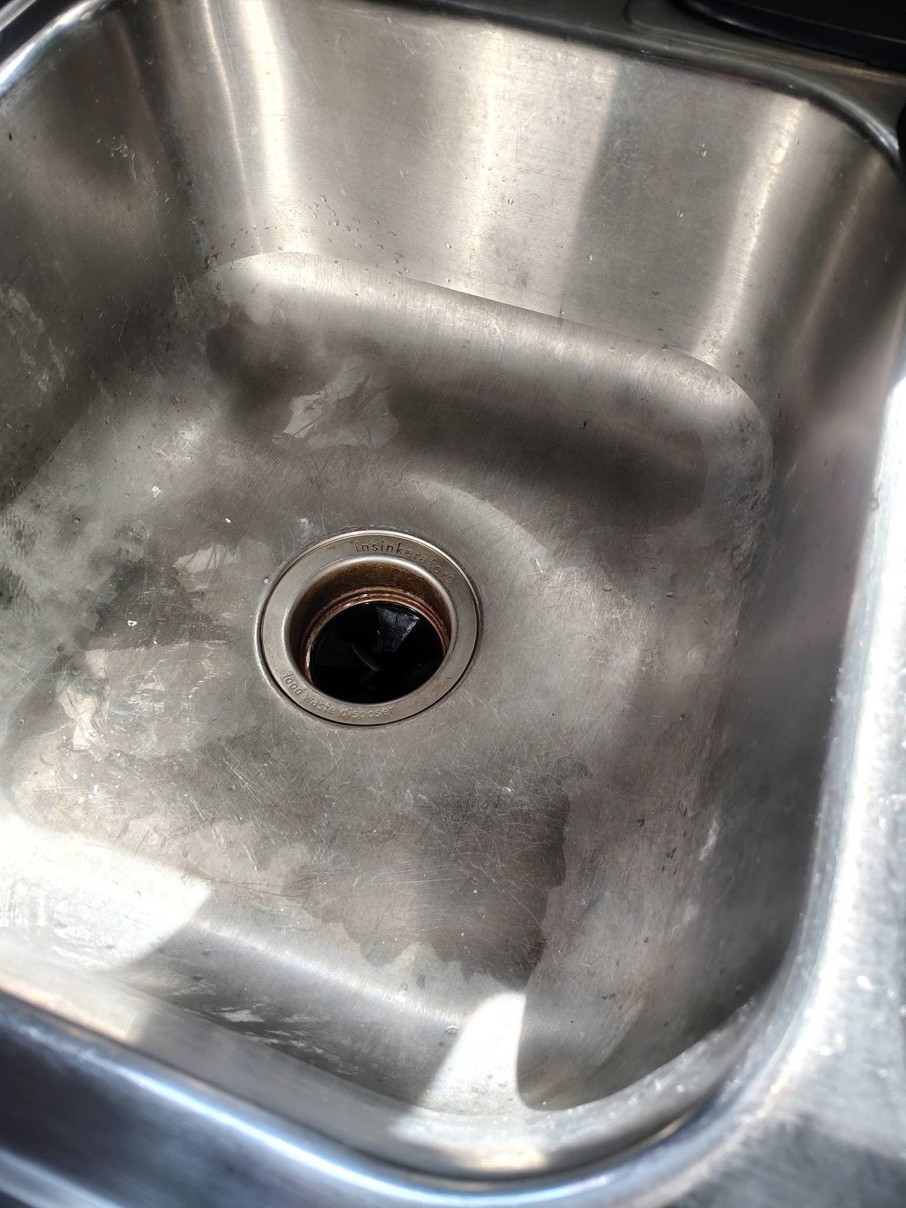 Stainless steel kitchen sink before deep cleaning