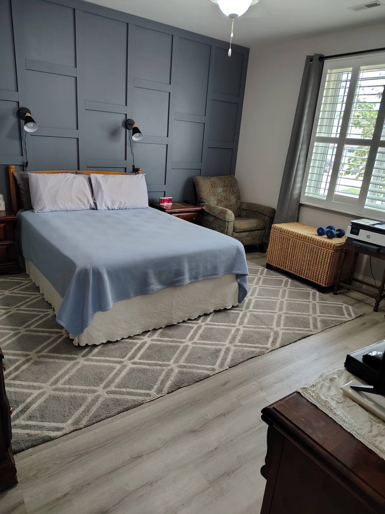 Same bedroom with a crisply made bed after cleaning