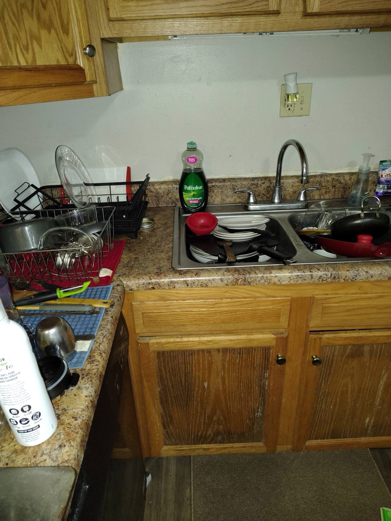 Cluttered sink and counter before cleaning