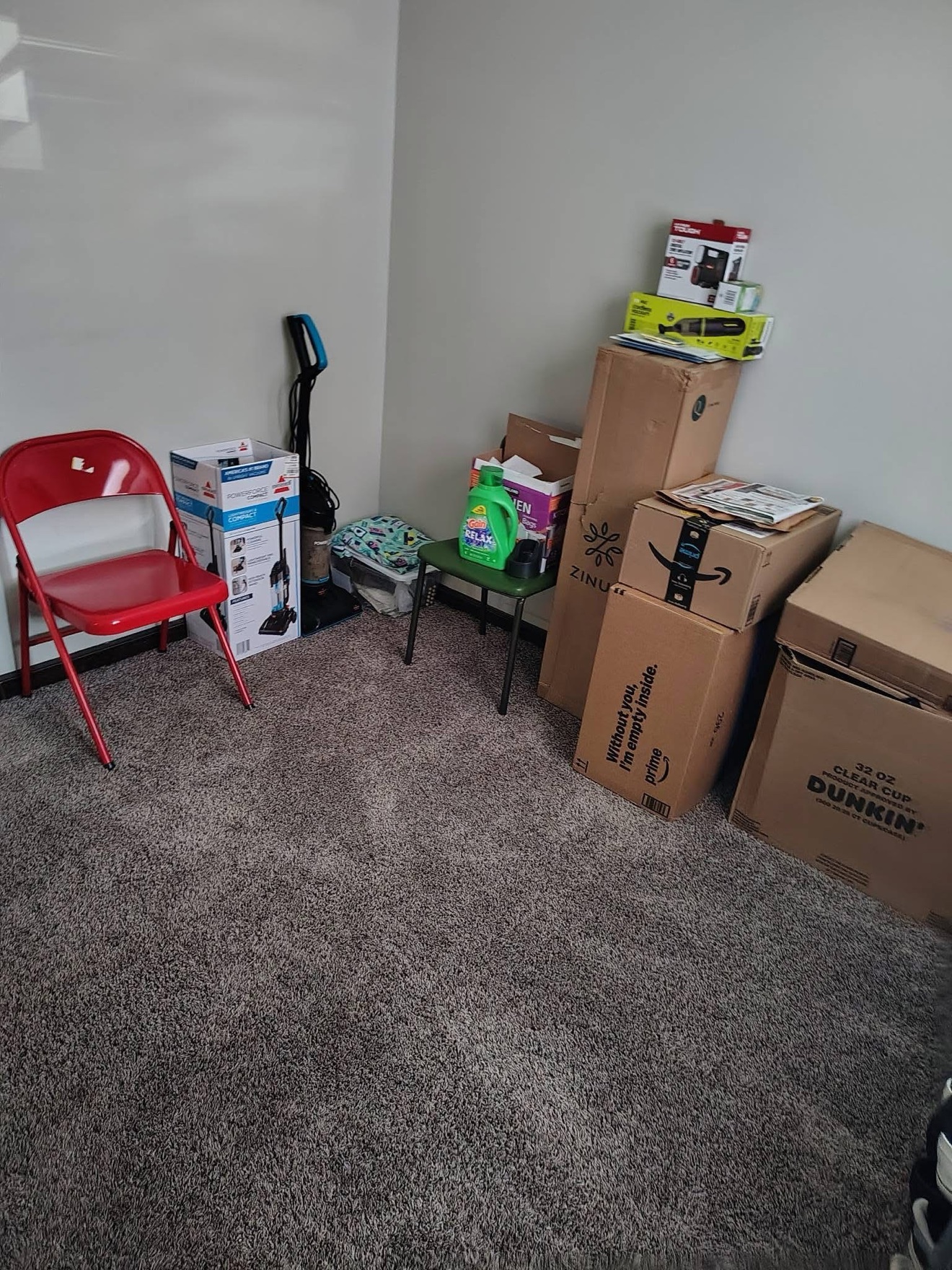 Living-room corner with boxes before organization